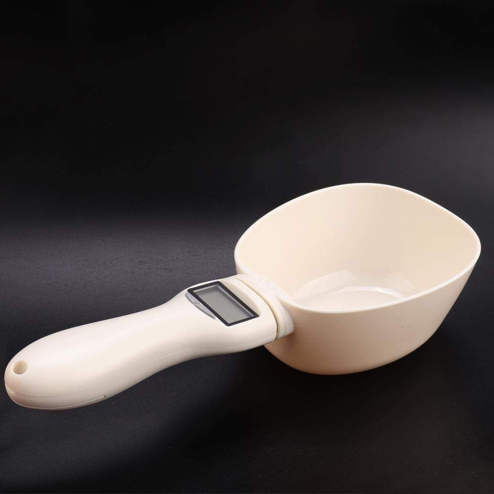 White measuring cup with digital display on a black background
