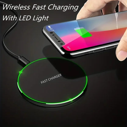Wireless fast charging pad with LED light indicator on a dark surface, showing a smartphone being charged.