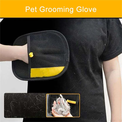 Pet grooming glove with black and yellow design, held by a person against a black background.