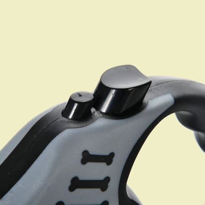 Close-up of a gray and black tool handle on a beige background