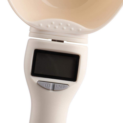Beige handheld device with a screen and 'UNIT' label on a white background